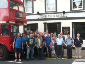 Standing outside The Old Mill by the routemaster bus